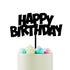 A white cake topped with a black "HAPPY BIRTHDAY" cake topper. The cake is adorned with pastel-colored, swirled frosting in pink, blue, and green shades. The background is plain white, emphasizing the cake and topper.