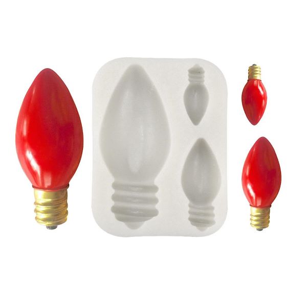 The image features a silicone mold designed to create 3D light bulb shapes. The mold itself is white and contains three cavities for different sizes of bulb designs. Next to the mold are several finished red light bulbs, showcasing a pointed, elongated shape with a gold base. The bulbs vary slightly in size, and the overall design mimics traditional decorative light bulbs.