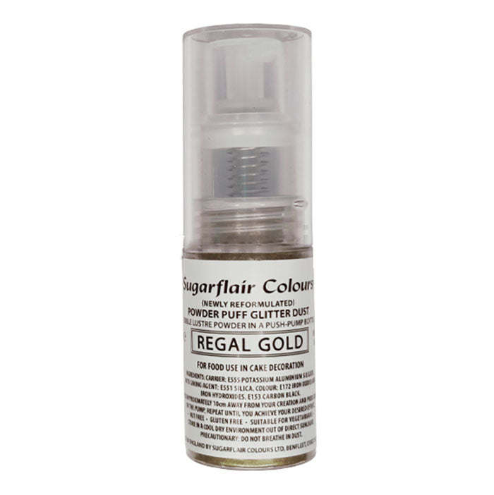 The image displays a spray bottle of Sugarflair Edible Glitter Dust in Regal Gold. The bottle is transparent with a push-pump cap at the top. The label on the bottle includes the product name "Sugarflair Colours" and indicates it is a "Powder Puff Glitter Dust" suitable for cake decoration. The label also mentions it is newly reformulated and provides information on its food safety and ingredient details. The glitter dust is contained within a small, cylindrical bottle.