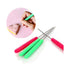 The image shows a set of three scriber modelling tools with colorful handles in pink, green, and a mix of both. The tools have thin metal tips for precise detailing. In the upper left corner, there is a close-up inset showing a hand holding a green scriber tool, used to draw on a pink heart-shaped cookie placed on a light pink surface. The overall composition highlights the tools and their application in cake decorating or cookie design.
