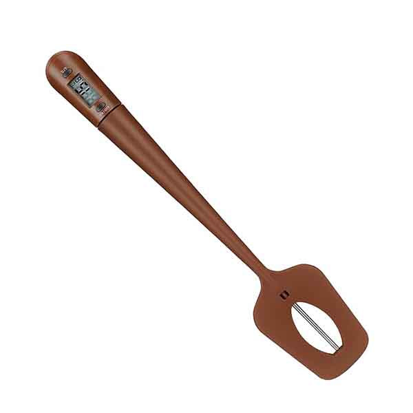 An elongated digital spatula with a flat, flexible head and a sleek brown handle. The spatula features a built-in digital thermometer display near the top of the handle, showing temperature readings. The head of the spatula has a cut-out oval shape for versatility in use.