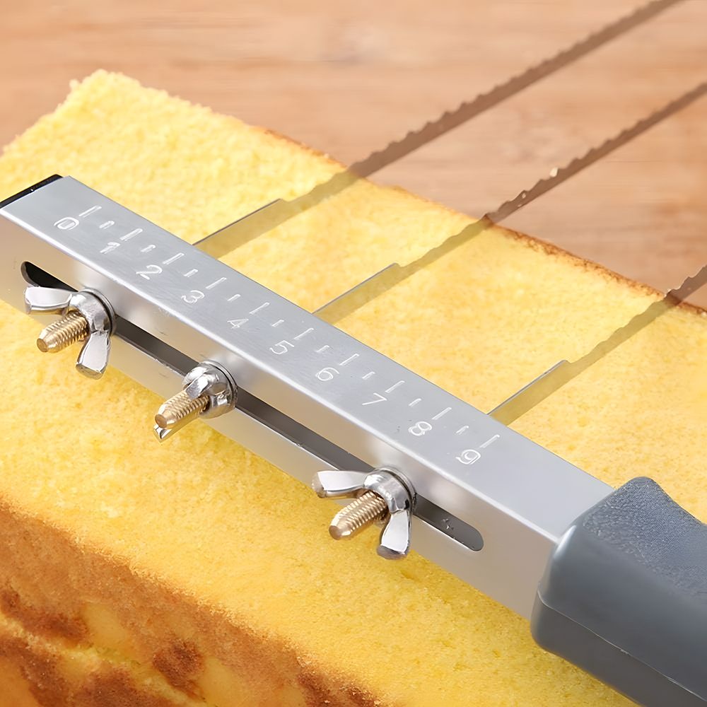 A cake is being sliced with a knife, showcasing the layers and frosting.