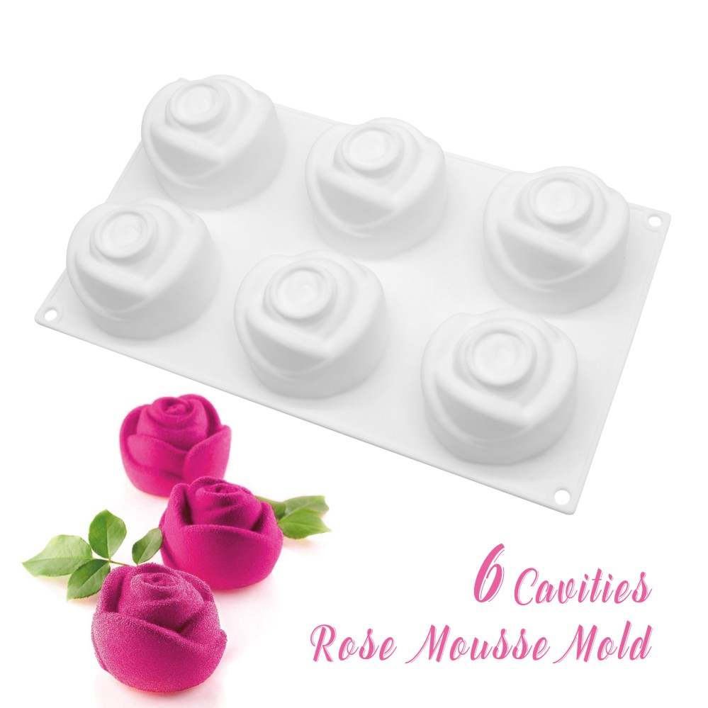 A white silicone mold shaped like rose flowers, featuring six cavities for creating rose-shaped desserts. Three vibrant pink rose desserts with green leaves are placed beside the mold. The text &quot;6 Cavities Rose Mousse Mold&quot; is displayed in a playful font.