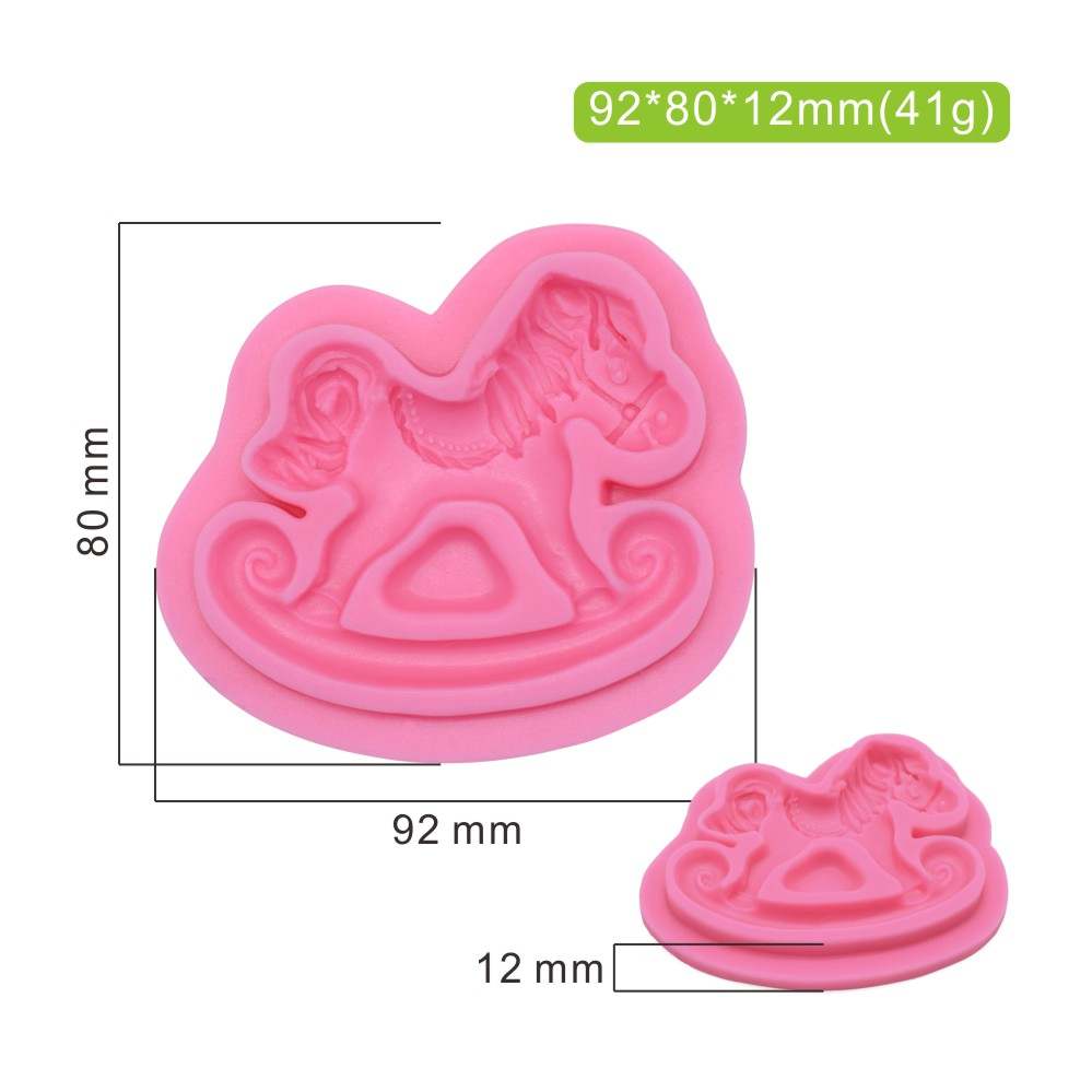 A pink silicone mould shaped like a rocking horse, with dimensions and weight noted. The mould features a detailed design of a rocking horse, measuring 92 mm in width, 80 mm in height, and 12 mm in depth. The weight of the mould is 41 grams.