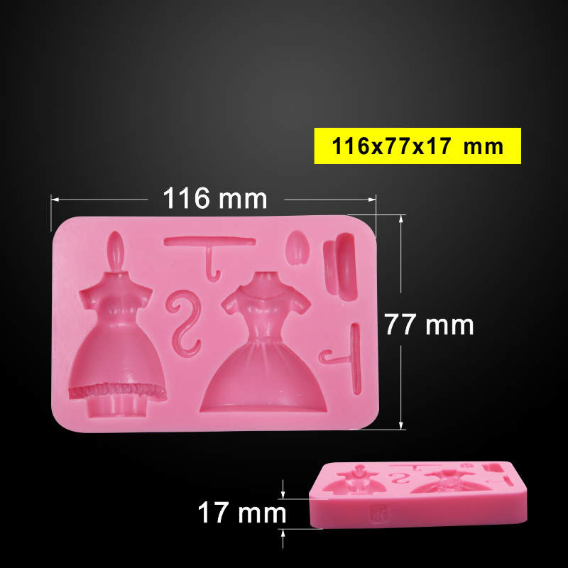 The image features a pink silicone mold designed for creating girl skirt hangers. The mold includes various shapes, including two dress figures, a hook, and a small hat. Dimensions of the mold are indicated as 116 mm by 77 mm, with a thickness of 17 mm. There is also a smaller section visible at the bottom with a star design. The background is black, emphasizing the details of the mold.