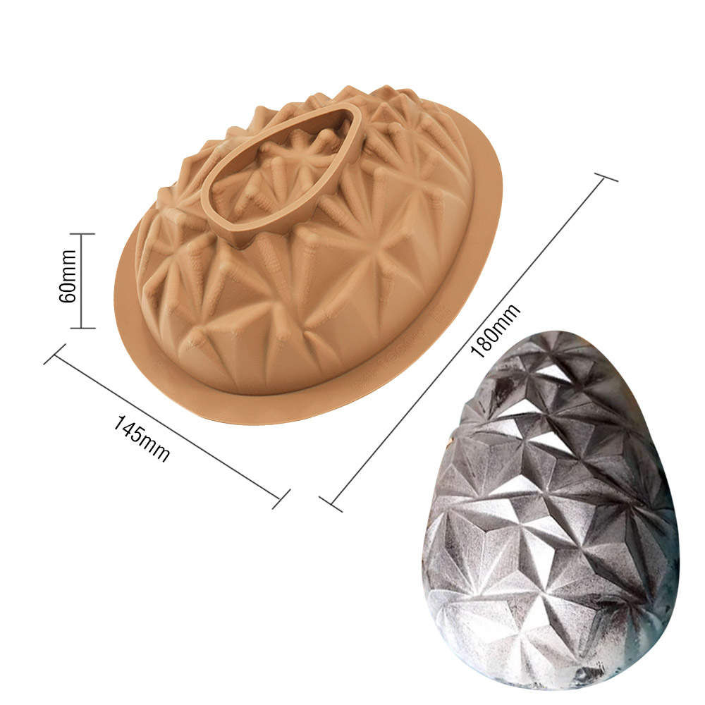 The image shows a 3D diamond egg silicone mold. The mold is light brown and features a textured surface with diamond-shaped patterns. It has a circular base and a handle at the top for easy removal. Dimensions are indicated next to the mold: 60mm in height, 145mm in width, and 180mm in length. Additionally, there is a smaller image of a completed egg made with the mold, which appears to have a shiny, metallic finish, showcasing the intricate diamond pattern.