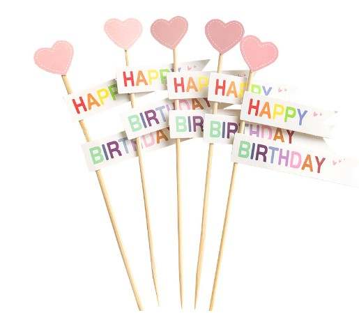 Image features a collection of birthday cake toppers. There are five decorative sticks, each topped with a pink heart or a flag that reads "HAPPY" and "BIRTHDAY" in colorful letters. The sticks are arranged together, presenting a festive and cheerful design suitable for birthday celebrations.