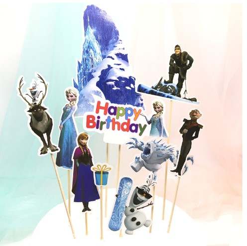 The image features a variety of cake toppers for a birthday celebration, themed around a frozen or winter motif. It includes several character cutouts on sticks, such as a reindeer, two princesses, a snowman, and a male character. There is also a large backdrop of a blue ice mountain and a festive &quot;Happy Birthday&quot; sign in colorful letters, along with a gift box and a snowboard. The background has a soft gradient, enhancing the festive appearance of the product.