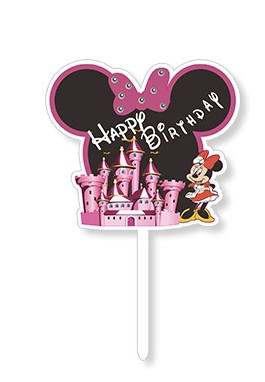 A cake topper featuring a pink and black design with large Mickey Mouse ears. The topper reads &quot;Happy Birthday&quot; in white text and includes an illustration of a pink castle along with a cartoon character resembling a female mouse in a red dress with white polka dots. The topper is mounted on a white stick.