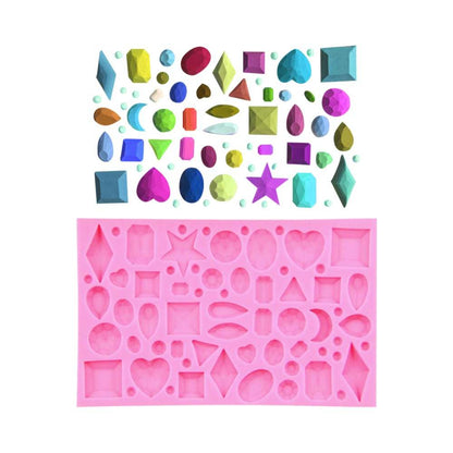 A pink silicone mold designed for creating gemstone shapes, featuring a variety of molds shaped like stars, hearts, diamonds, and other geometric figures. Above the mold is an assortment of colorful, jewel-shaped objects in various sizes and designs, showcasing different shapes such as teardrops, rectangles, and ovals. The overall arrangement is vibrant and decorative, illustrating the versatility of the mold for crafting.