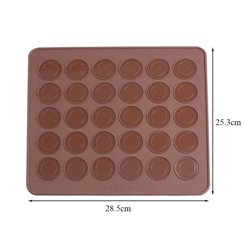 The image shows a brown silicone mat designed for making macarons. The mat features a grid of circular indentations, with 20 circles arranged in four rows and five columns. It has dimensions of 28.5 cm in width and 25.3 cm in height. The mat has a smooth surface suited for baking and is flexible for easy removal of baked goods.