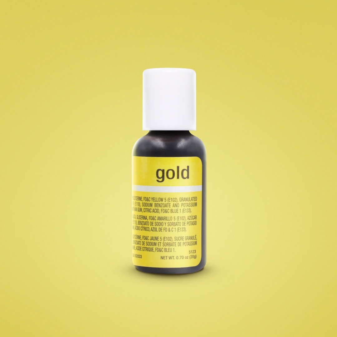 The image shows a small bottle of Chefmaster Liqua Gel Color in gold, with a white cap. The bottle is predominantly black with a yellow label stating &quot;gold&quot; and contains information about the product&