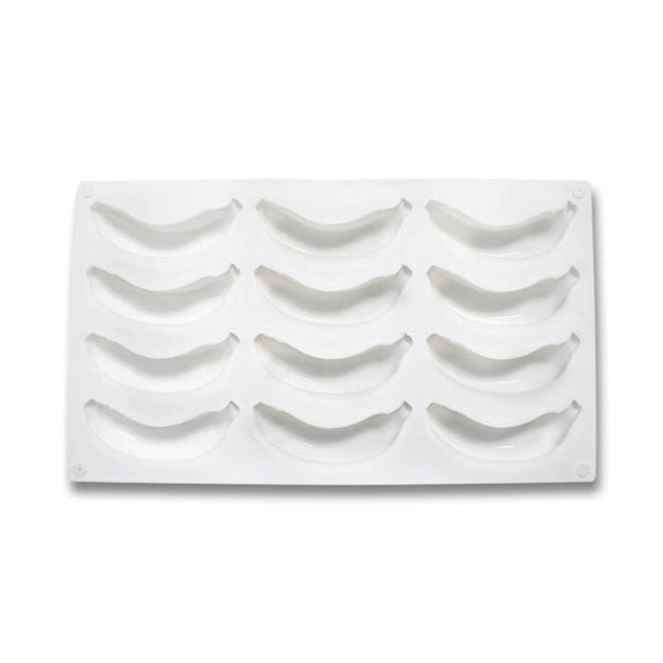 A white silicone mold featuring 12 banana-shaped cavities arranged in two rows. The mold is flexible and designed for creating 3D banana-shaped treats or desserts.