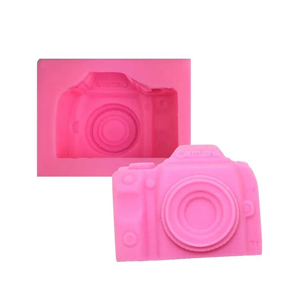 A pink silicone mould shaped like a 3D camera, with a detailed impression showing the camera&