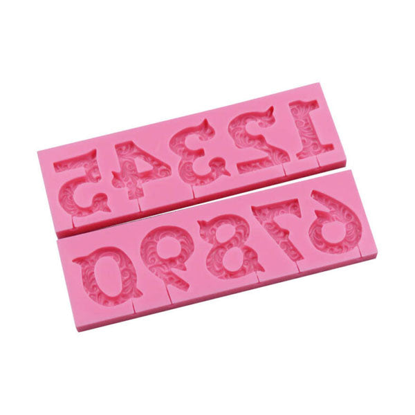A pink silicone mold featuring raised designs of numbers 0 to 9. The numbers are arranged in two sections, with the top section displaying the numbers 1, 3, 4, 2 and the bottom section displaying the numbers 4, 7, 8, 0. The mold is flexible and designed for creating three-dimensional number decorations.