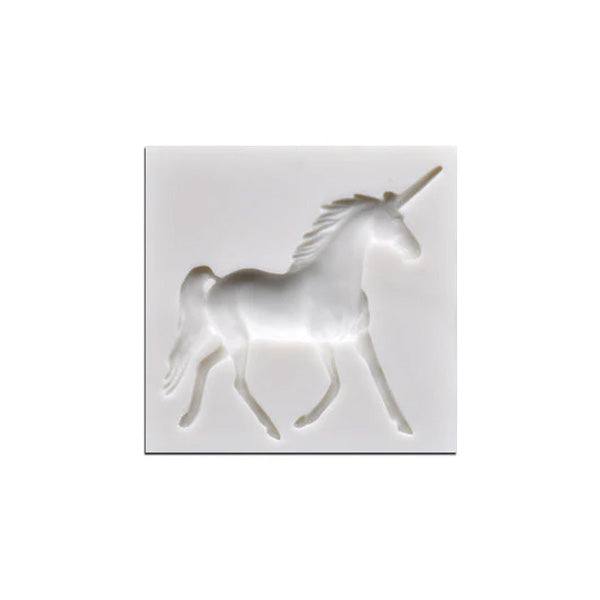 A white silicone mould featuring a three-dimensional outline of a unicorn in a walking pose. The unicorn has a prominent horn and a flowing mane, set against a square background.