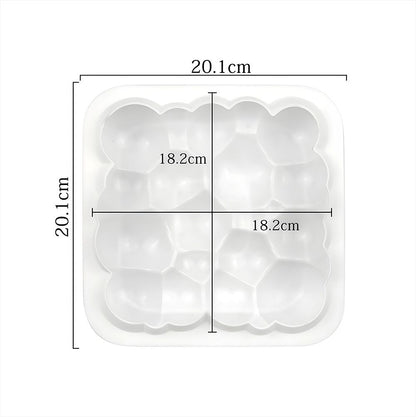A square tray featuring four assorted sizes of ice cream scoops in vibrant colors, artistically arranged.