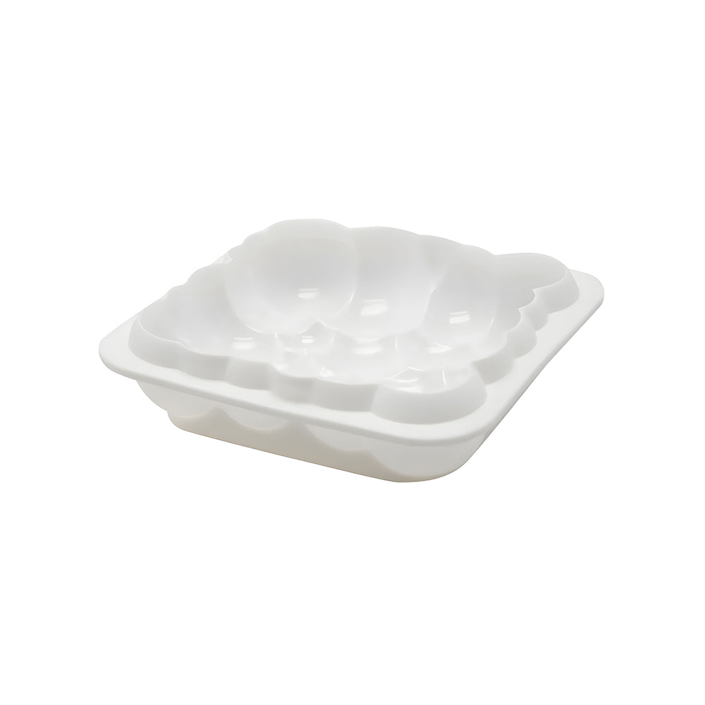 A white plastic dish featuring a colorful flower design on its surface