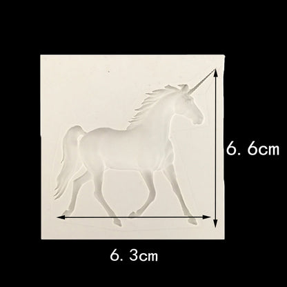 A silicone mould shaped like a unicorn horse, featuring a detailed design of the unicorn in a walking pose. The mould is square with dimensions of 6.6 cm in height and 6.3 cm in width, indicated by measurements on the sides. The mould has a smooth surface and a translucent appearance.