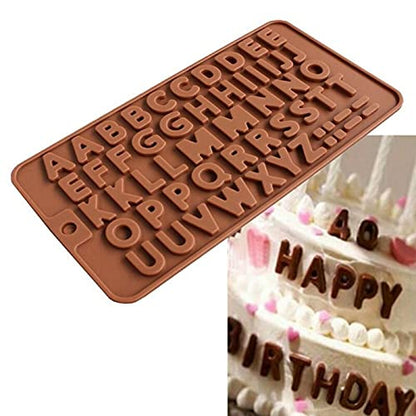 An image featuring a brown silicone mold shaped like the English alphabet. The mold includes both uppercase and lowercase letters arranged in rows. In the corner of the image, there is a partially visible birthday cake decorated with the letters &quot;HAPPY&quot; and &quot;BIRTHDAY,&quot; showcasing the use of the silicone mold for cake decoration.