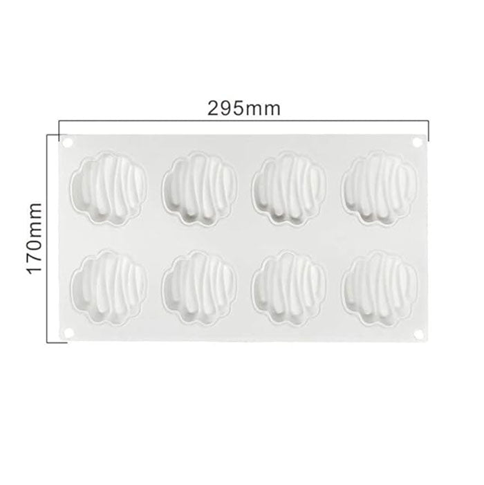 A white silicone mould displaying eight cavities shaped like decorative entremets. The mould measures 295mm in width and 170mm in height, with a textured, zig-zag pattern inside each cavity.