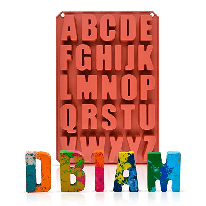 A red silicone mold featuring uppercase letters of the English alphabet arranged in a grid. Below the mold, there are colorful, three-dimensional letters spelling out "DBIAM," each with a different bright color and marbled design. The background is plain, emphasizing the mold and the letters.