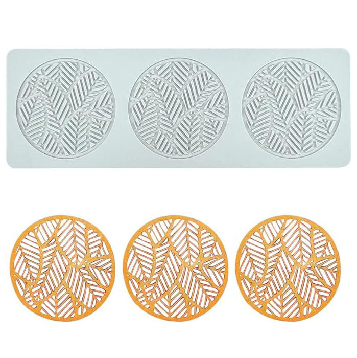 The image features a silicone mold designed to create hollow tree leaf shapes. The mold is a pale color and contains three circular sections, each intricately detailed with a leaf pattern. Below the mold, there are three orange silicone pieces that have been shaped by the mold, showcasing the same leaf design. The overall presentation highlights the creative possibilities of the product for baking or crafting purposes.