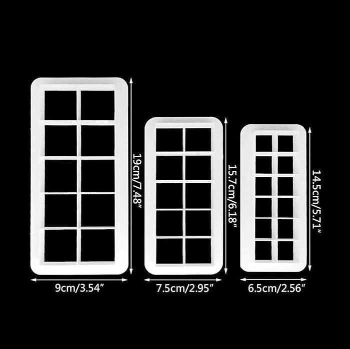 An image of three geometric square cookie cutters displayed on a black background. The cutters are white plastic and are categorized by size, each featuring a grid pattern. The largest cutter measures 19 cm (7.48 inches) tall and 9 cm (3.54 inches) wide. The middle cutter measures 15.7 cm (6.18 inches) tall and 7.5 cm (2.95 inches) wide. The smallest cutter measures 14.5 cm (5.71 inches) tall and 6.5 cm (2.56 inches) wide. Measurement labels are included beside each cutter.