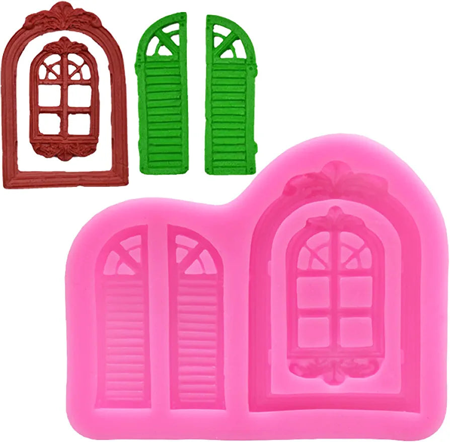 A pink silicone mold featuring a detailed arched window design with a decorative top and two vertical shutter doors. Above the mold, there is a brown window-shaped object and two green shutter doors. The mold and objects are designed for crafting or decorating purposes.