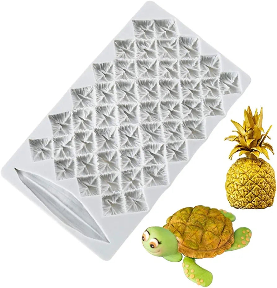 A white silicone mold designed to create pineapple-shaped items, featuring textured patterns resembling pineapple skin. Next to the mold, there&