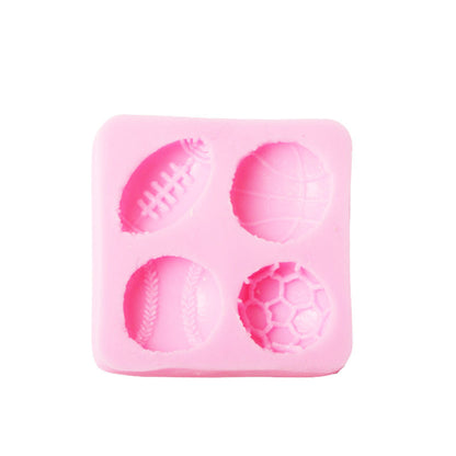 A pink silicone mold designed for making mini ball-shaped treats. The mold features four different sports balls: a football, a basketball, a baseball, and a soccer ball, each with detailed textures that represent their respective designs.