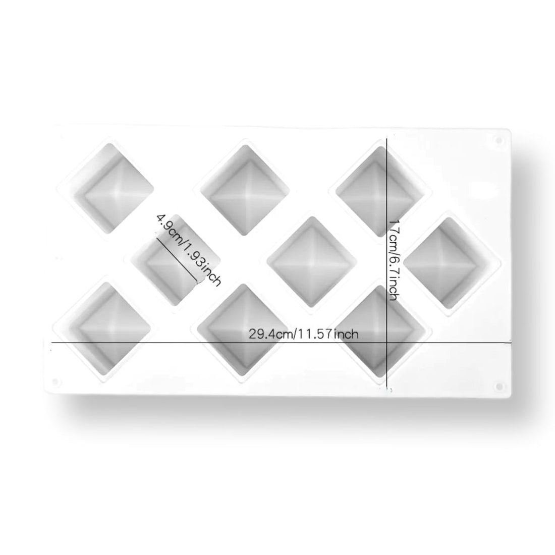 A white silicone mold featuring nine cavity shapes, each with a concave design resembling cubes. The mold includes measurement annotations: 29.4 cm (11.57 inches) in length, 17 cm (6.7 inches) in width, and each cavity approximately 4.9 cm (1.93 inches) deep. The mold is flexible and suitable for making various shaped treats or desserts.