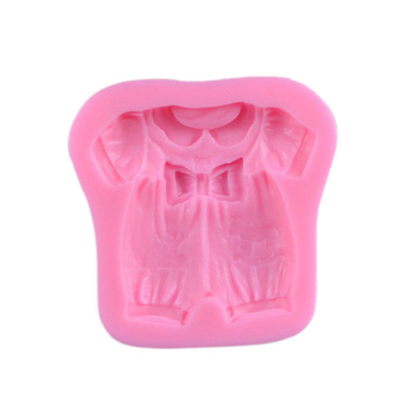 A pink silicone mould shaped like a baby girl&