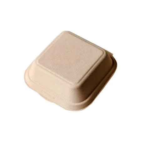 A bento cake box is shown in the image. It is a square, eco-friendly container made from a biodegradable material, featuring a slightly textured surface. The box has a lid that fits snugly on top, and the overall color is a natural beige tone, suggesting a simplistic and sustainable design suitable for carrying small cakes or desserts.