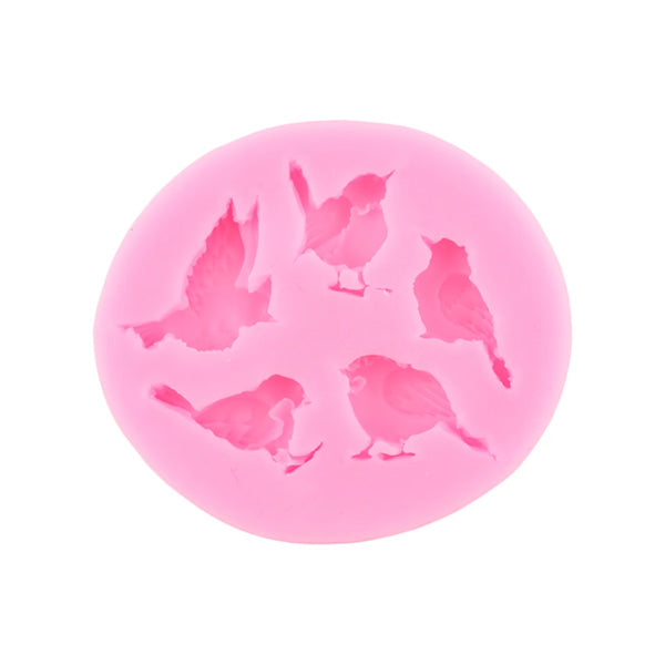 A round pink silicone mould featuring five different bird shapes. The mould has detailed impressions of various birds in different poses.