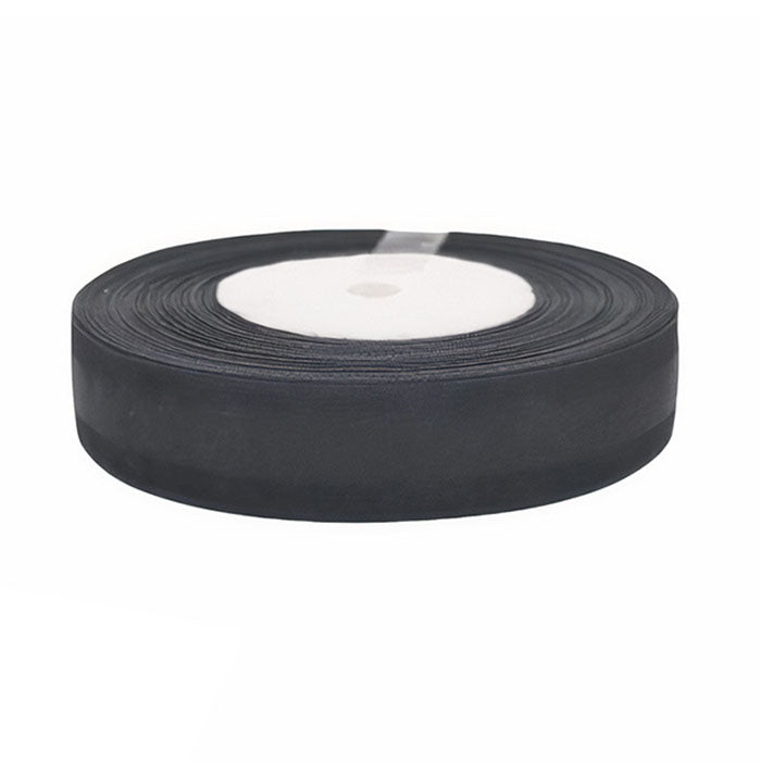 A roll of black ribbon, 50 yards in length, is displayed. The ribbon is neatly coiled and has a circular white core visible in the center. The outer edge of the ribbon is smooth and uniform.