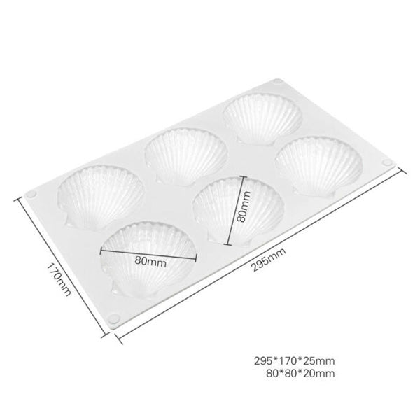A white silicone mould designed to create six clam shell-shaped items. The mould dimensions are labeled, measuring 295mm by 170mm by 25mm, with each clam shell cavity measuring 80mm by 20mm. The mould features detailed shell patterns and is flat with rounded corners.
