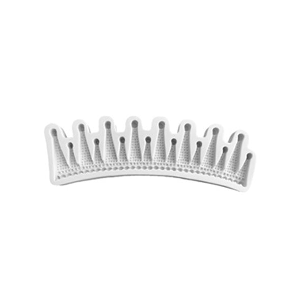 A white silicone mould shaped like a crown, featuring a series of pointed peaks and small holes along the top edge. The mould has a textured surface with a dotted pattern, designed for creating crown-shaped decorations.