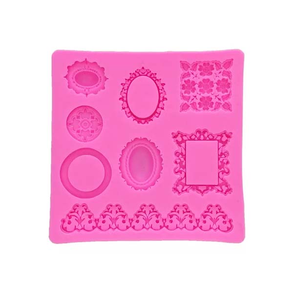 A pink silicone mould featuring a variety of frame shapes and designs. The mould includes nine cavities in different styles, including ornate frames, an oval frame, a circular shape, and decorative elements. The overall design is square-shaped, with detailed patterns and borders embossed in the silicone.