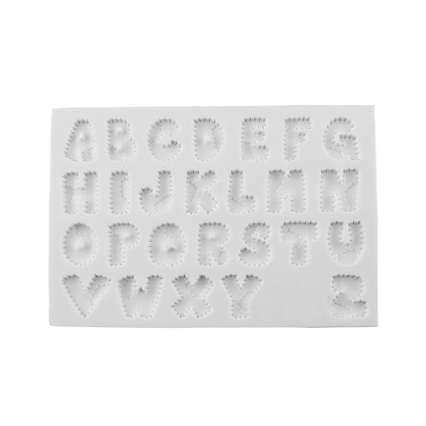 The image features a white silicone mold with uppercase letters of the English alphabet arranged in a grid format. Each letter has a funky, irregular outline, creating a whimsical design. The letters are presented in a clear, embossed style, allowing for easy identification when used for baking or crafting. The mold includes all letters from A to Z, with each letter uniquely shaped and spaced evenly on the rectangular mold.