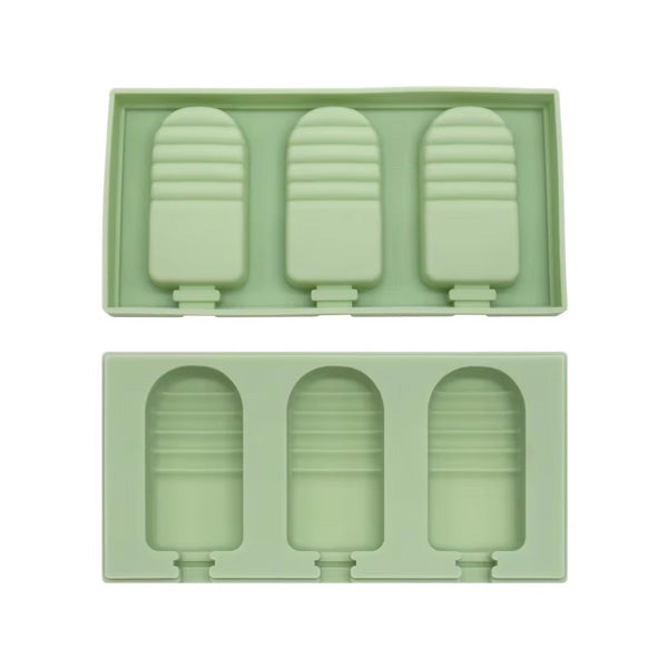 A green silicone mold for making half strip cakesickles, featuring three cavities shaped like popsicles. The mold consists of two parts: a top section with three raised popsicle shapes and a bottom section that holds the shapes. The design includes ridges on each popsicle shape for texture.