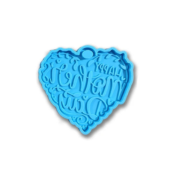A blue silicone mould shaped like a heart. The mould features the embossed text "Happy Mother&