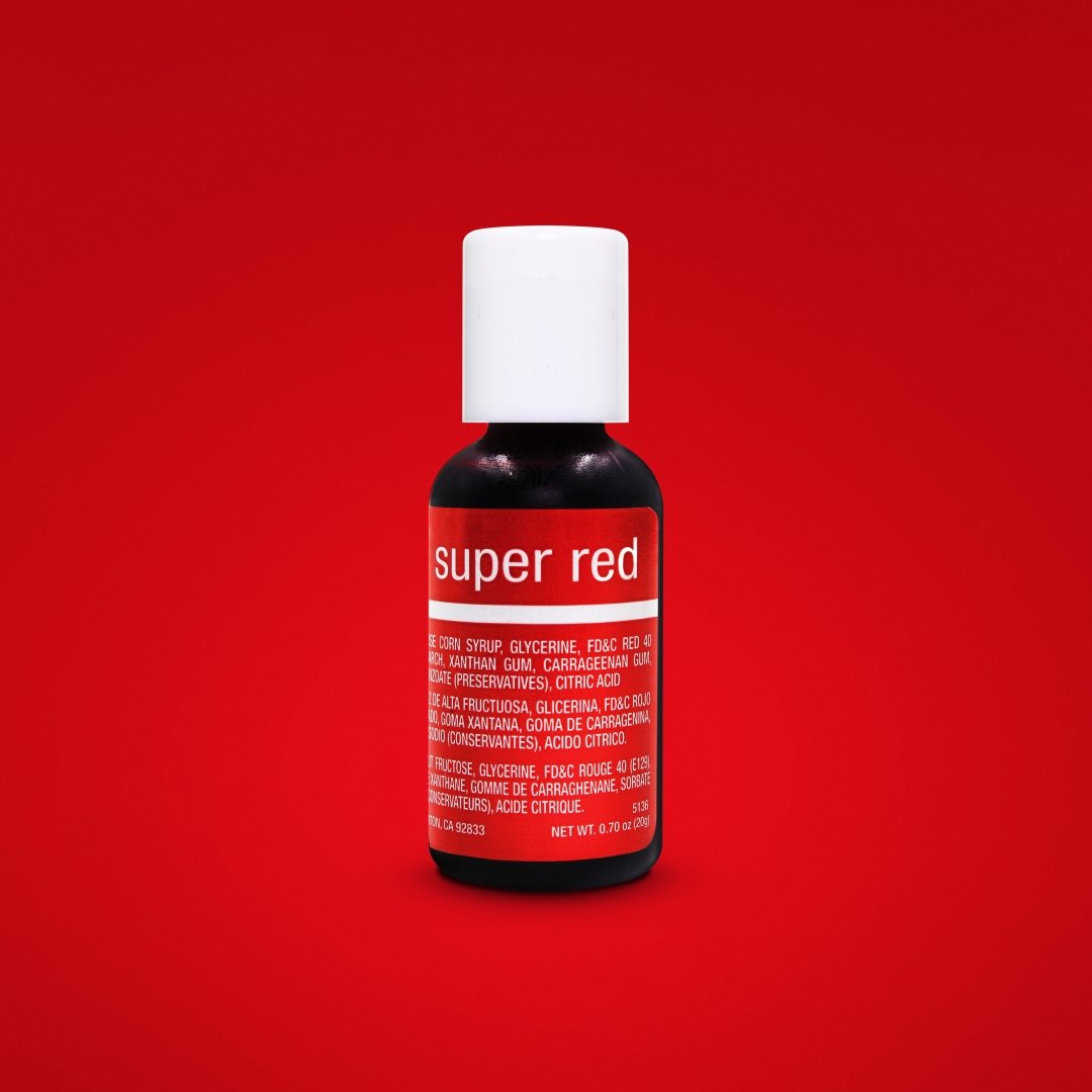 A dark bottle of Chefmaster Liqua-Gel food color in &quot;Super Red&quot; is centered against a solid red background. The bottle has a white cap and a bright red label featuring the text &quot;super red.&quot; The label also includes ingredients and product information in both English and Spanish, indicating it contains corn syrup, glycerin, and various stabilizers. The bottle contains 0.7 oz (20 ml) of product.