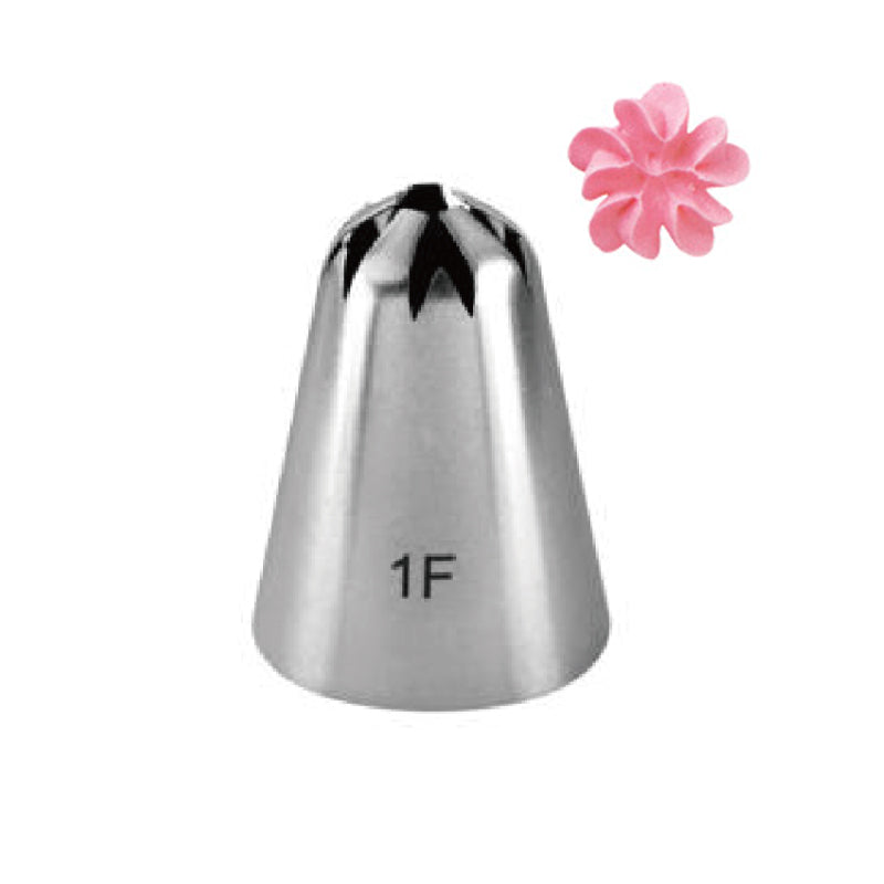 A silver piping nozzle with a pointed end and a star-shaped opening, labeled "1F," is shown in the center. To the right, there is a small pink flower decorated from icing or fondant, resembling a flower shape. The background is plain and white.