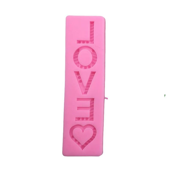 A pink silicone mould designed for making shaped letters and symbols. The mould features the word "LOVE" prominently displayed in a bold font, with an additional heart shape included. The design is simple and playful, ideal for baking or crafting projects.