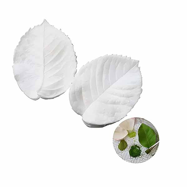 A leaf petal veiner set featuring two white, textured leaf-shaped molds. The molds are designed to replicate the veining and shape of real leaves. In the corner of the image, a small circle displays a variety of colored leaves, showcasing the veiners&