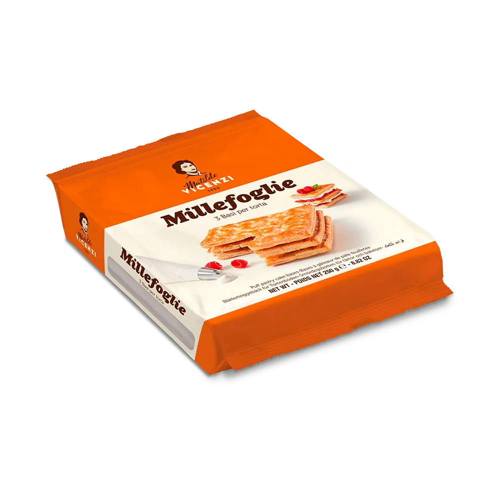 A package of Matilde Vicenzi puff pastry bases, labeled &quot;Millefoglie,&quot; weighing 250 grams. The package is predominantly orange, featuring a depiction of layered pastry with a fork and garnished with strawberries. The label states &quot;3 basi per torta&quot; (3 bases for cake) and includes nutritional information and instructions.