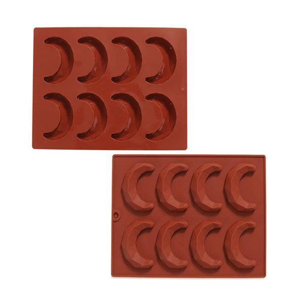 Two silicone molds, each with eight cavities shaped like crescent moons, presented in a terracotta color. The molds are stacked on top of each other, showcasing their design.