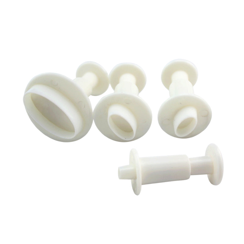 A set of four oval-shaped plunger cutters in different sizes, made of white plastic. The cutters have a round disc on top with a narrow handle for pressing down. They vary in size, with the largest on the left and three smaller ones arranged in decreasing size to the right.