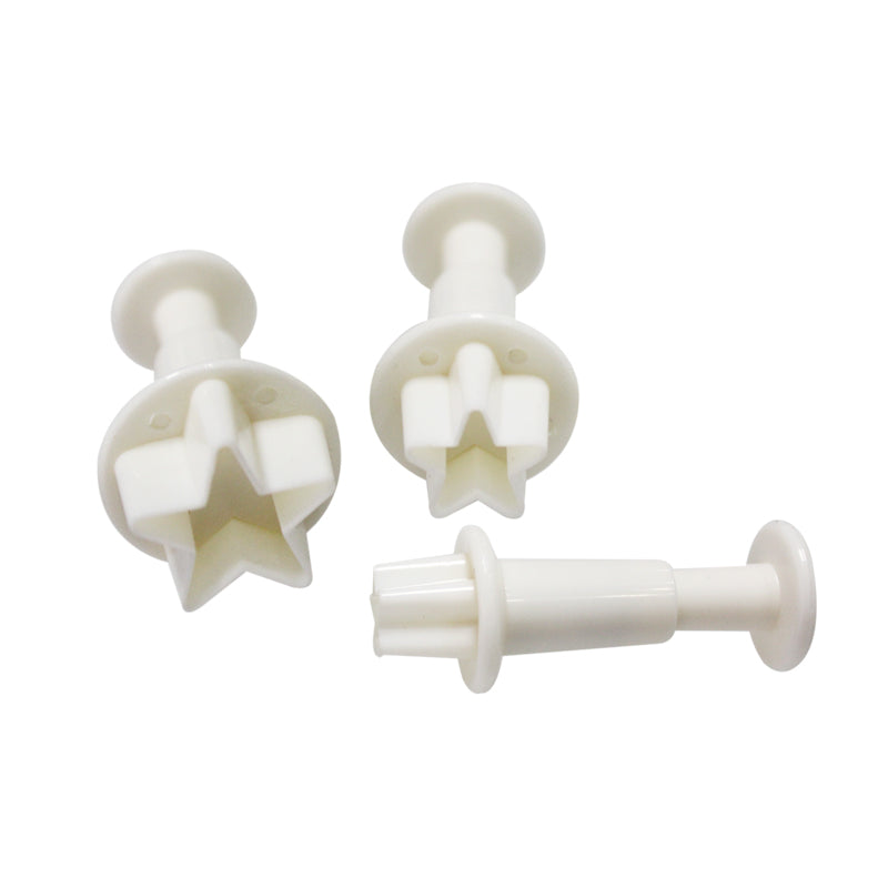 A set of three white plunger cutters in star shapes, designed for baking and decoration. Each cutter has a round base and a star-shaped cutting edge with a central plunger for easy use. The cutters are arranged in various positions, showcasing their different sizes and shapes.